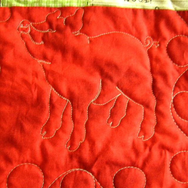 Close up of bac showing pig quilting.